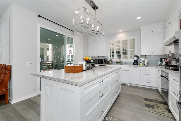 a kitchen with sink a counter top space and appliances