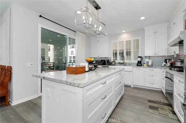 a kitchen with sink a counter top space and appliances