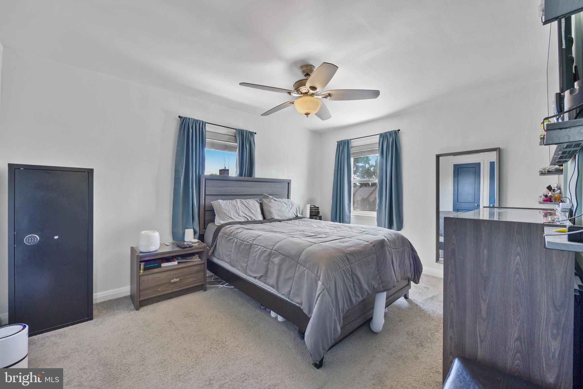 4511 Marble Hall Road Baltimore, MD 21239 - Photo 21 of 48 a bedroom with a bed ceiling fan and a window