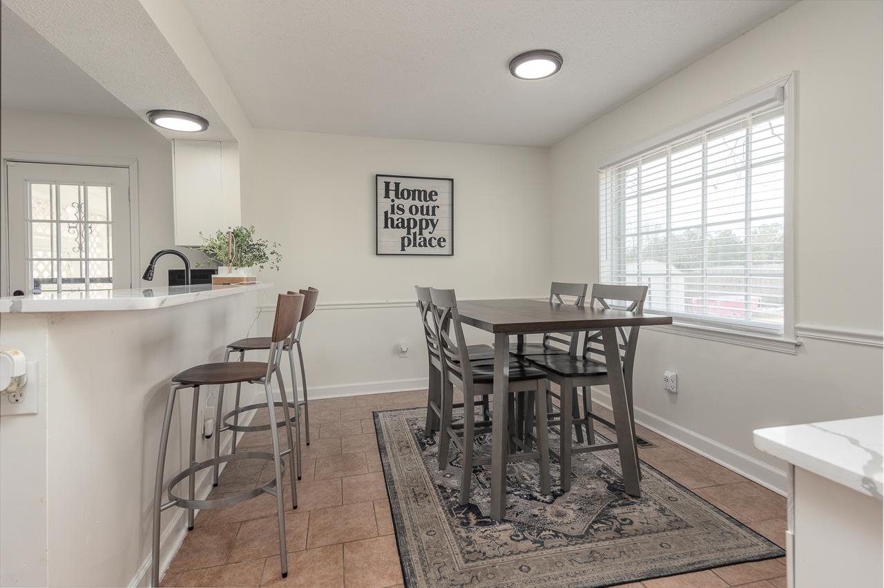 2835 McVay Trail Drive Memphis, TN 38119 - Photo 15 of 29 Dining area featuring light tile patterned floors and sink