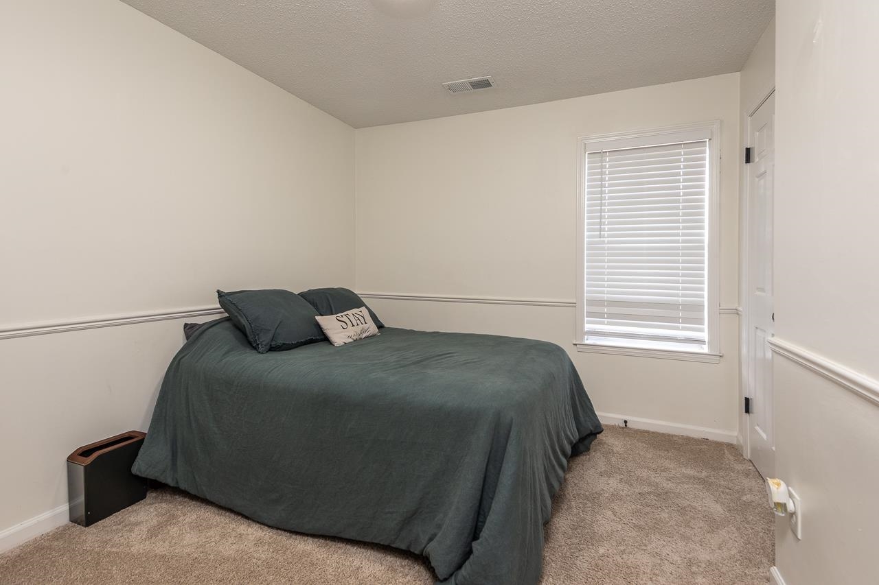 2835 McVay Trail Drive Memphis, TN 38119 - Photo 24 of 29 Carpeted bedroom featuring a textured ceiling