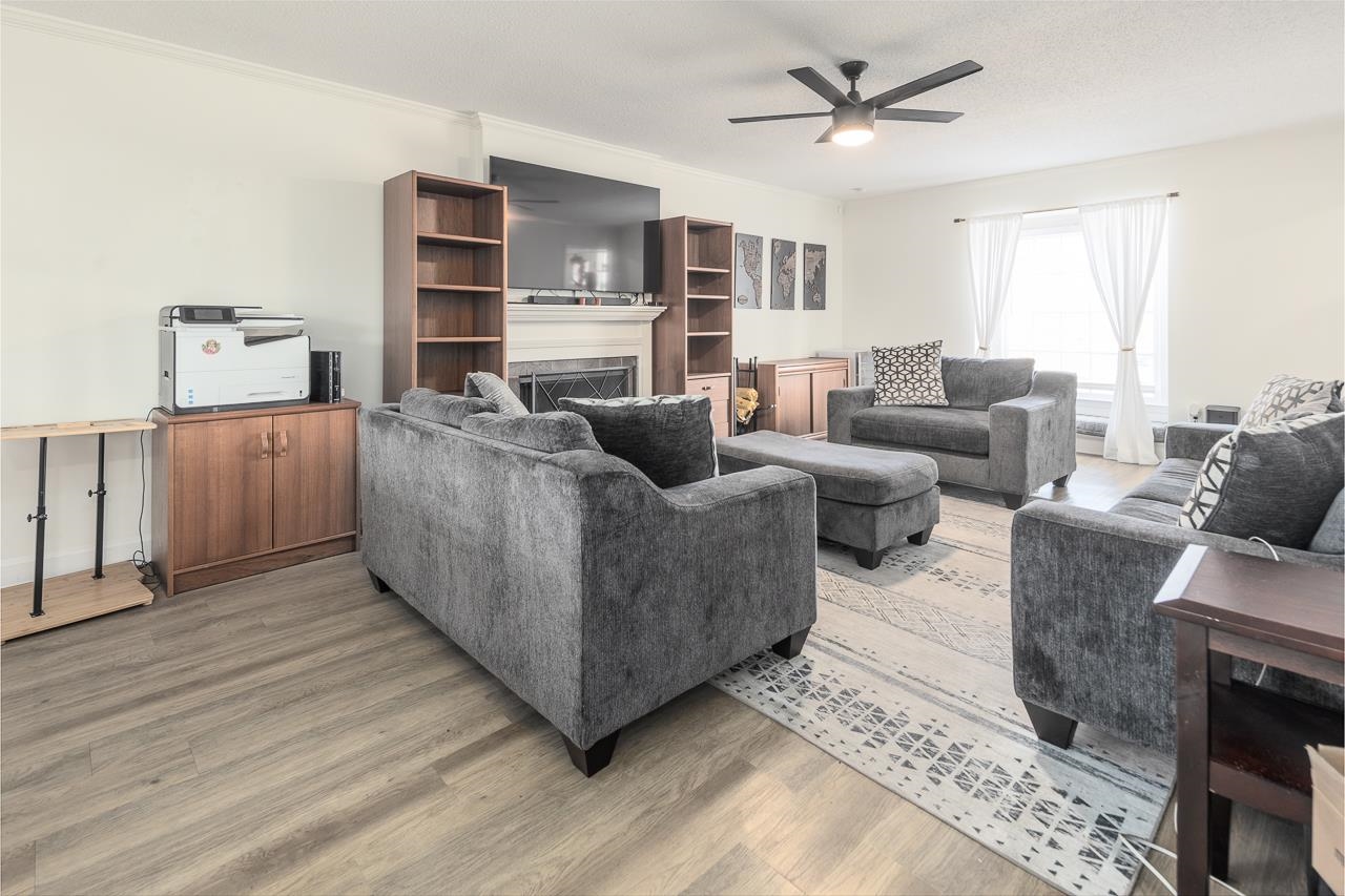 2835 McVay Trail Drive Memphis, TN 38119 - Photo 5 of 29 Living room featuring ceiling fan, wood-type flooring, and crown molding