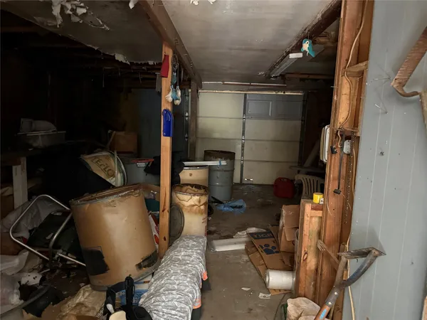 a room with water heater and wooden racks