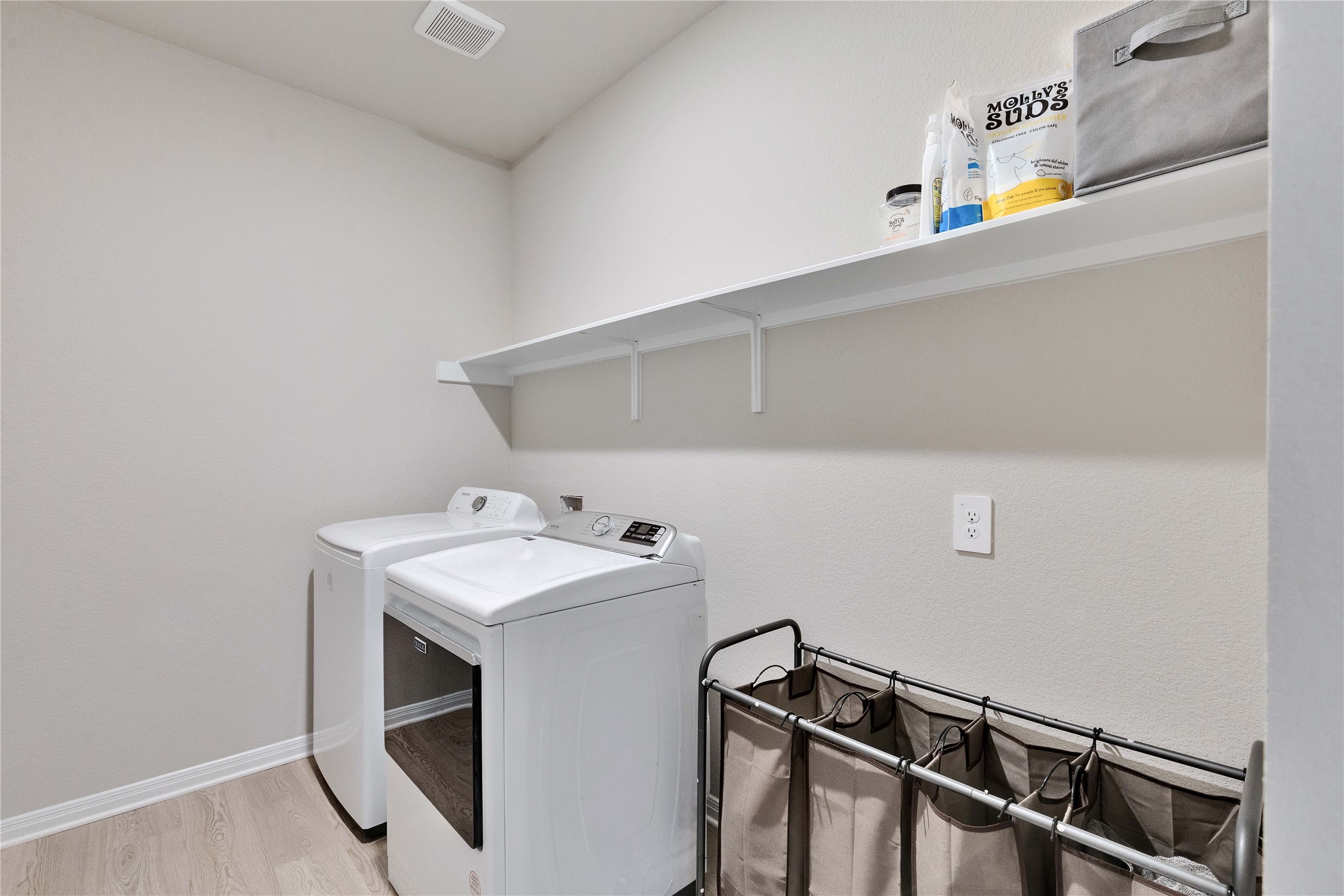 12308 Dairywork Road Buda, TX 78610 - Photo 20 of 24 The dedicated laundry room provides a convenient space for everyday household tasks.