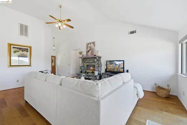 a living room with furniture and a window