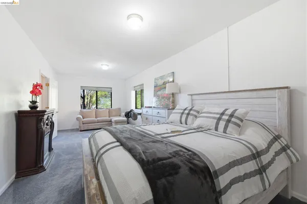 a bedroom with a bed and a closet