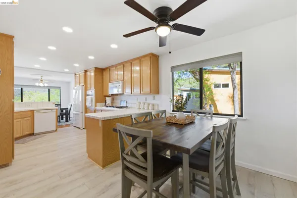 a view of a dining room with furniture and window