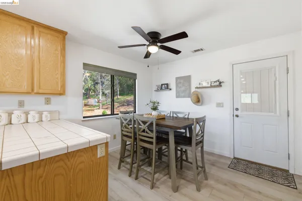 a view of a kitchen area with furniture and a window