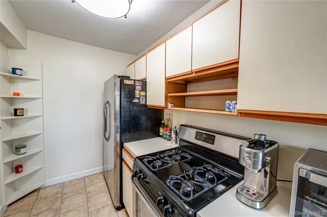 a kitchen with a stove and a refrigerator