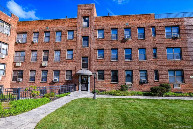 a brick building view that has a lots of windows in it