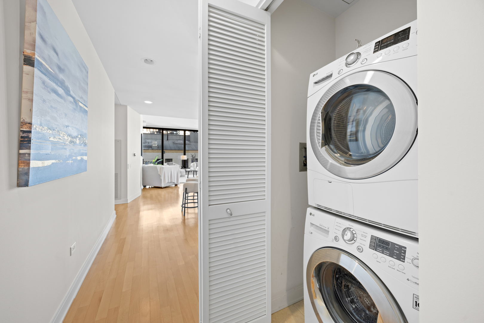 60 East Monroe Street, Unit 2307 Chicago, IL 60603 - Photo 19 of 27 a view of a hallway with washer and dryer