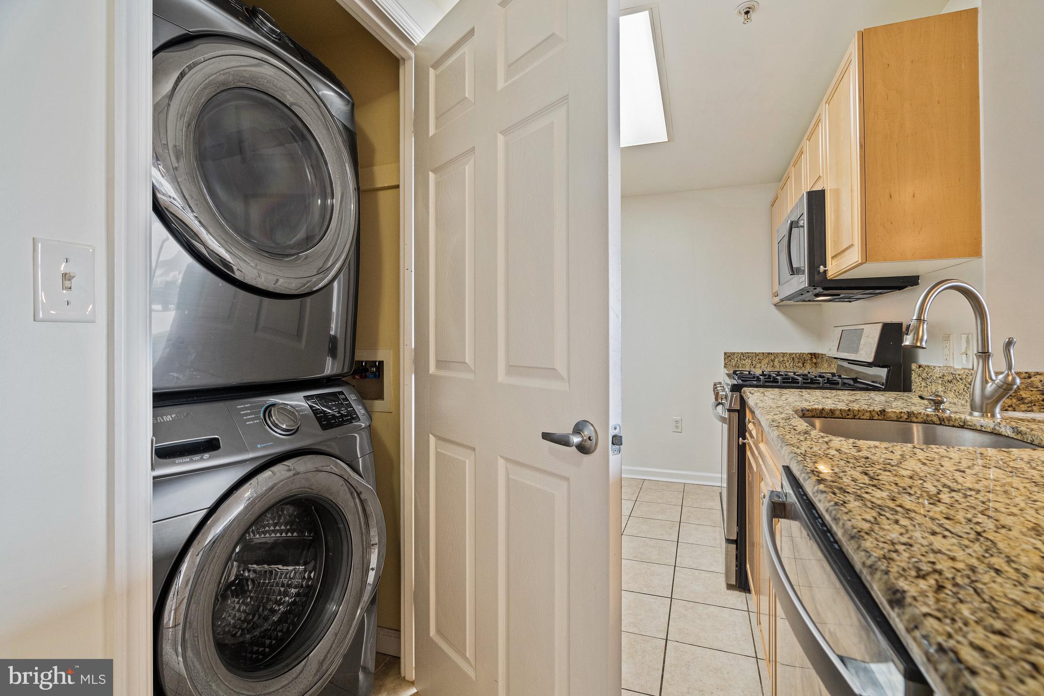 2726 Gallows Road, Unit 712 Vienna, VA 22180 - Photo 22 of 55 a utility room with sink dryer and washer