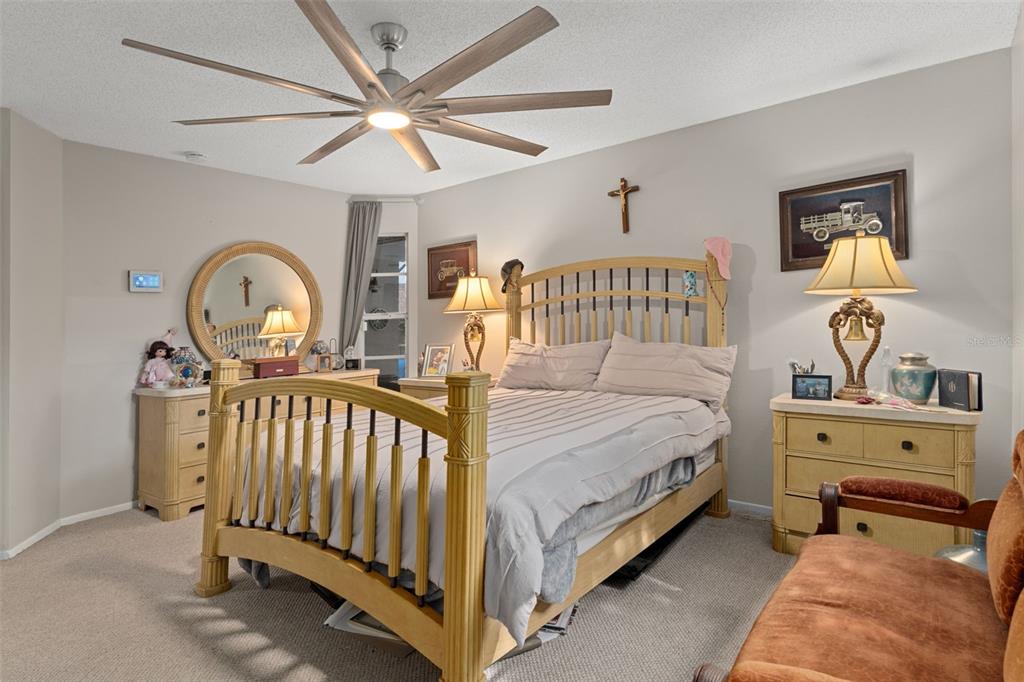 4355 Goldcoast Avenue Spring Hill, FL 34609 - Photo 16 of 30 a bed room with a bed and a baby crib