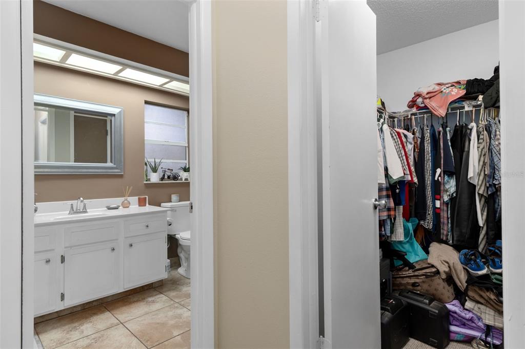 4355 Goldcoast Avenue Spring Hill, FL 34609 - Photo 18 of 30 a view of walk in closet with clothes