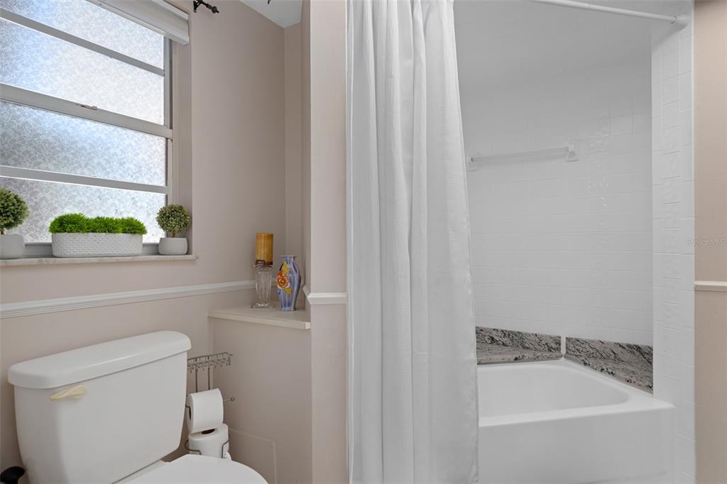 4355 Goldcoast Avenue Spring Hill, FL 34609 - Photo 21 of 30 a bathroom with a sink a toilet and a window