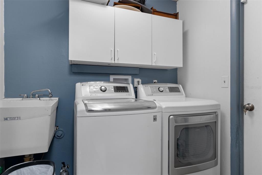 4355 Goldcoast Avenue Spring Hill, FL 34609 - Photo 24 of 30 a utility room with dryer and washer