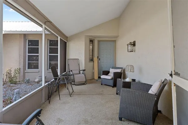 a living room with furniture and windows