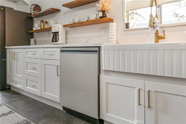 a kitchen with cabinets and a window