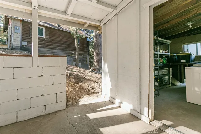 a view of a yard with wooden fence