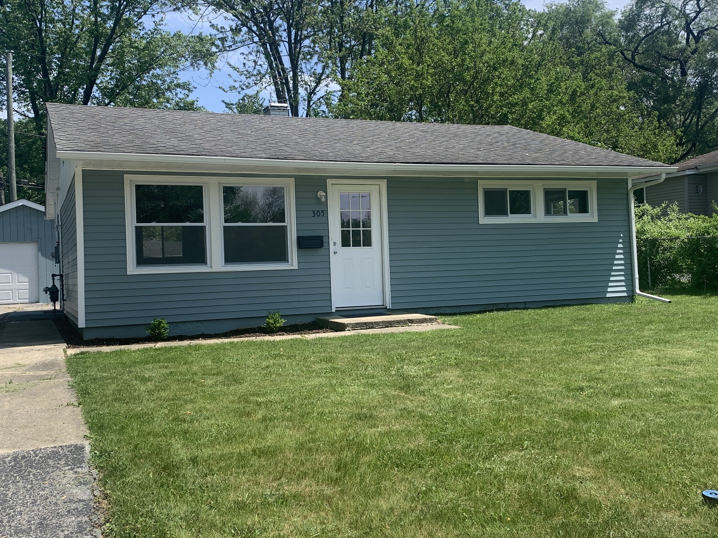 a view of a house with a garden