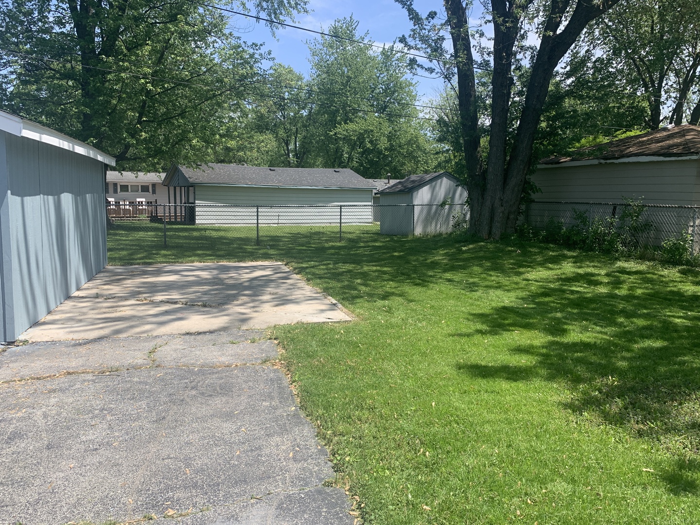 305 Tiverton Lane Steger, IL 60475 - Photo 3 of 13 a view of a yard with a house and a large tree