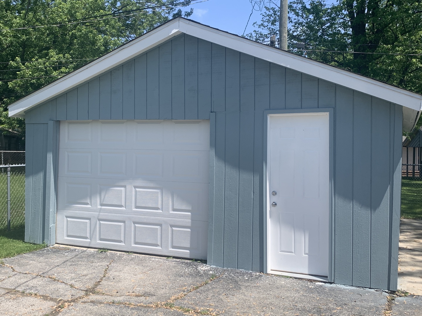 305 Tiverton Lane Steger, IL 60475 - Photo 4 of 13 a front view of a house with a yard and garage