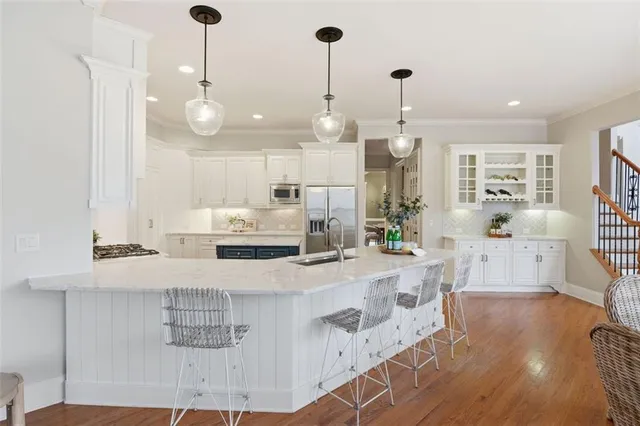 a kitchen with cabinets and a stove