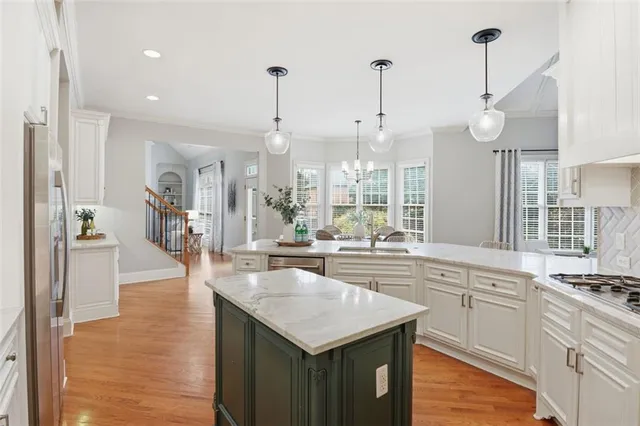 a kitchen with appliances and cabinets