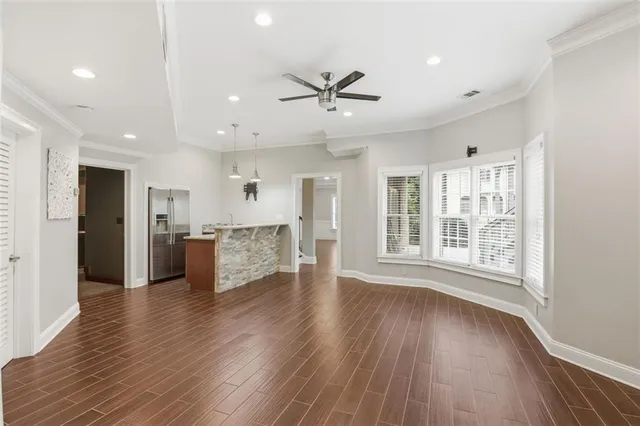 a view of a balcony with wooden floor and fence