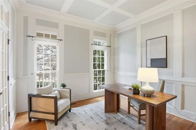 a living room with furniture a window and a table