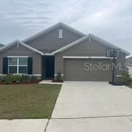 a front view of a house with yard