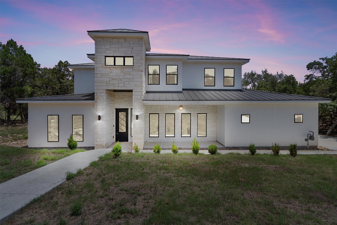 a front view of a house with a yard