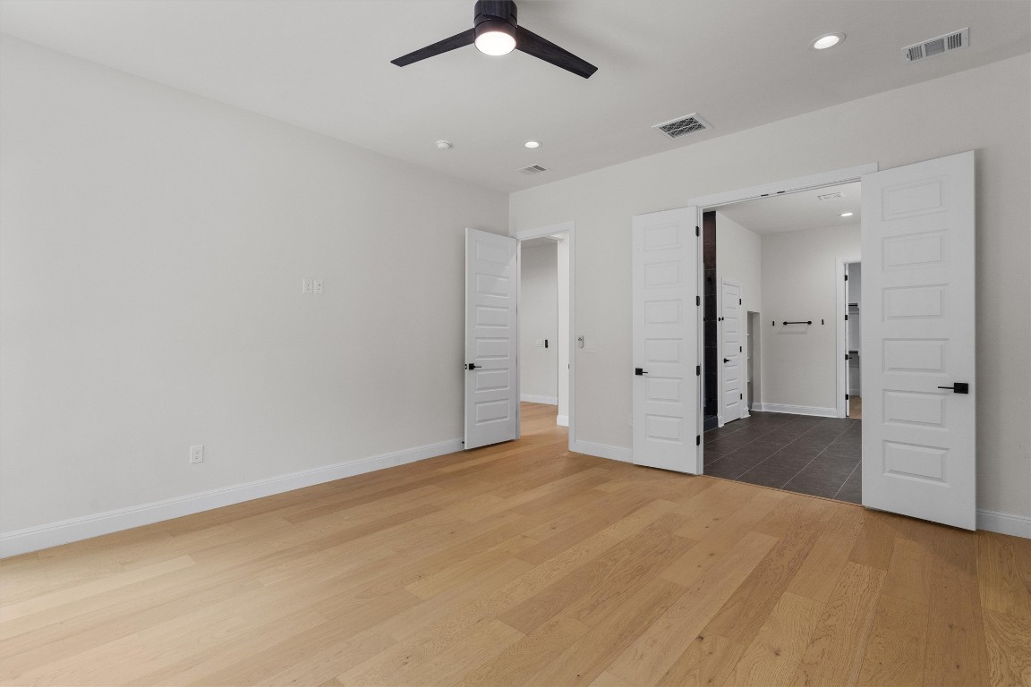 7705 Calcutta Run Drive Jonestown, TX 78645 - Photo 17 of 40 an empty room with closet and a ceiling fan