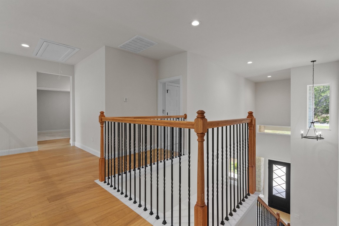 7705 Calcutta Run Drive Jonestown, TX 78645 - Photo 22 of 40 a view of a hallway with windows