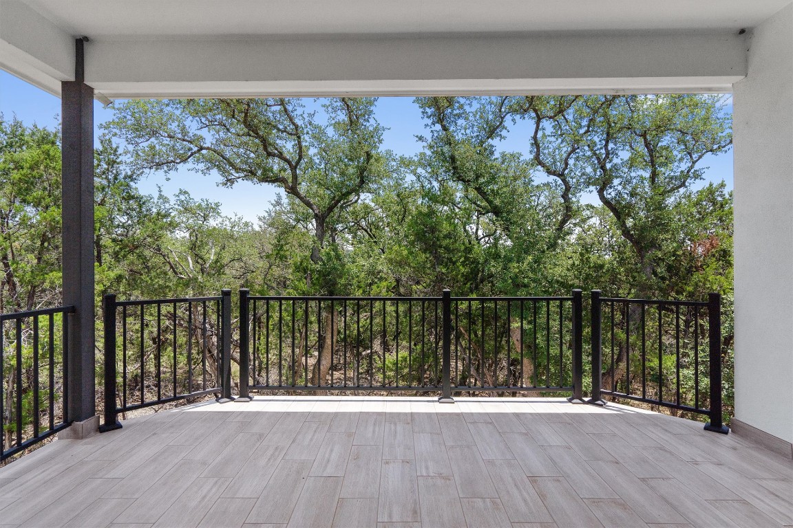 7705 Calcutta Run Drive Jonestown, TX 78645 - Photo 23 of 40 a view of a balcony with wooden floor