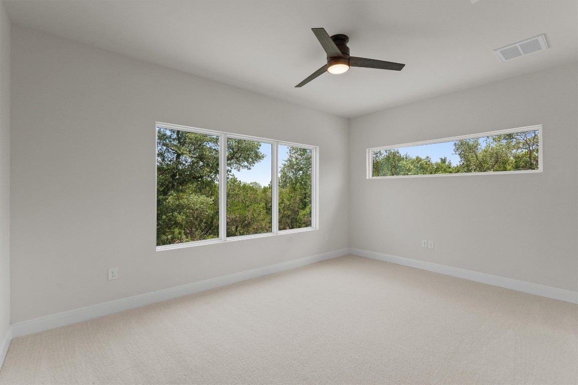 7705 Calcutta Run Drive Jonestown, TX 78645 - Photo 25 of 40 an empty room with a window
