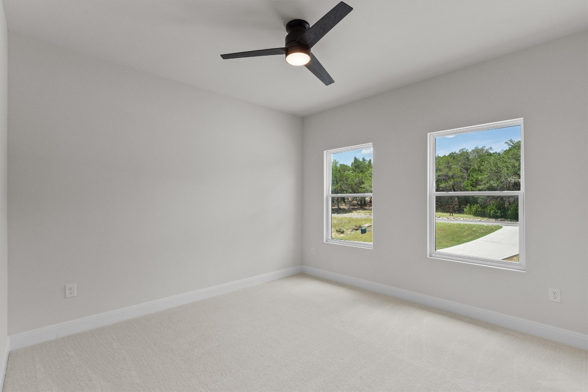7705 Calcutta Run Drive Jonestown, TX 78645 - Photo 26 of 40 a view of an empty room with a window