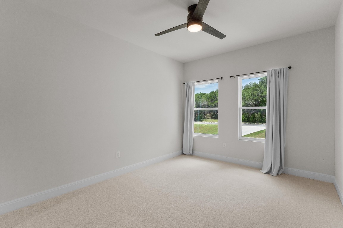 7705 Calcutta Run Drive Jonestown, TX 78645 - Photo 29 of 40 an empty room with a window