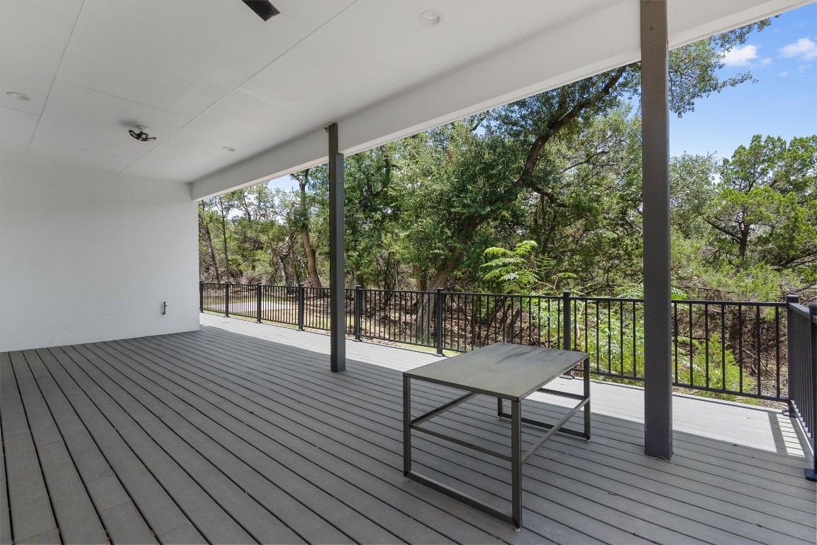 7705 Calcutta Run Drive Jonestown, TX 78645 - Photo 32 of 40 a view of a room with wooden floor and outdoor space