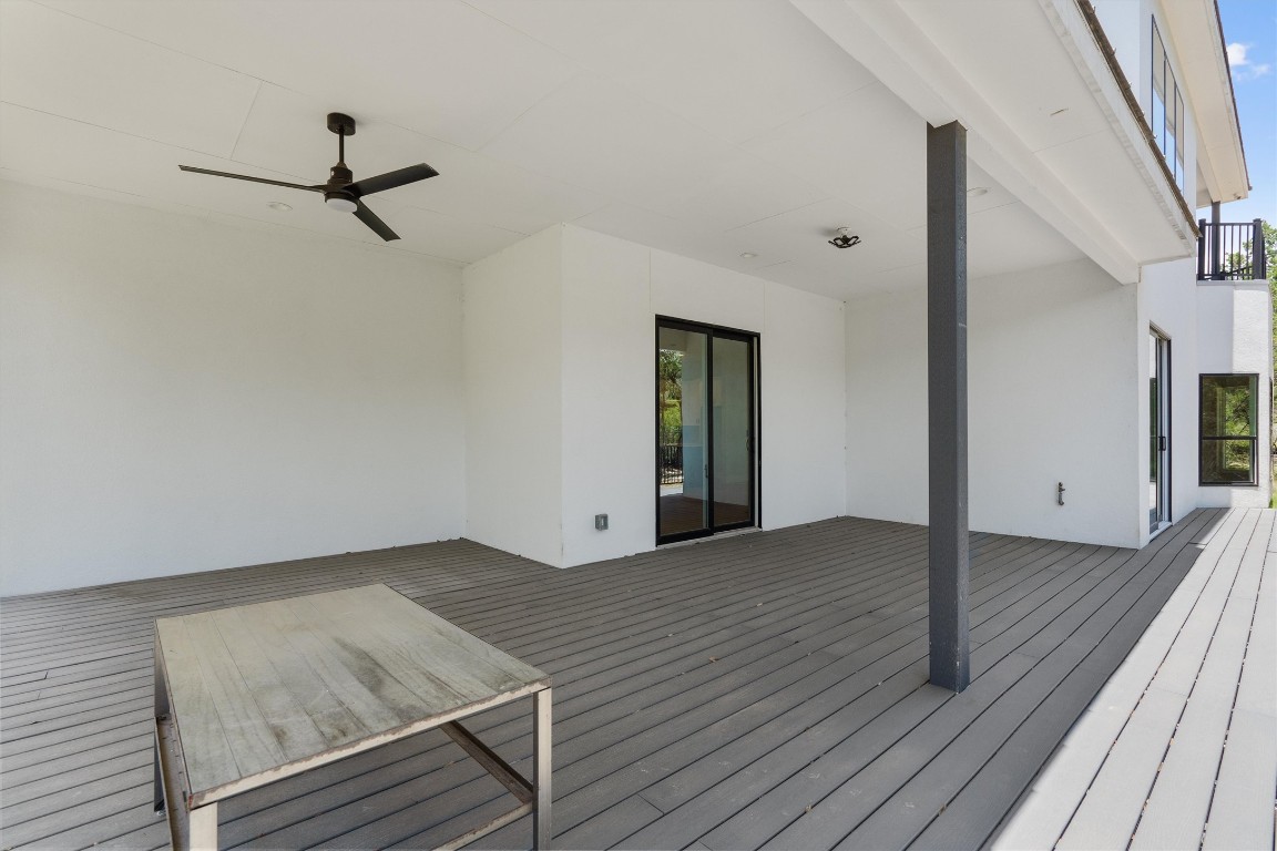 7705 Calcutta Run Drive Jonestown, TX 78645 - Photo 33 of 40 a view of an empty room with wooden floor and a window