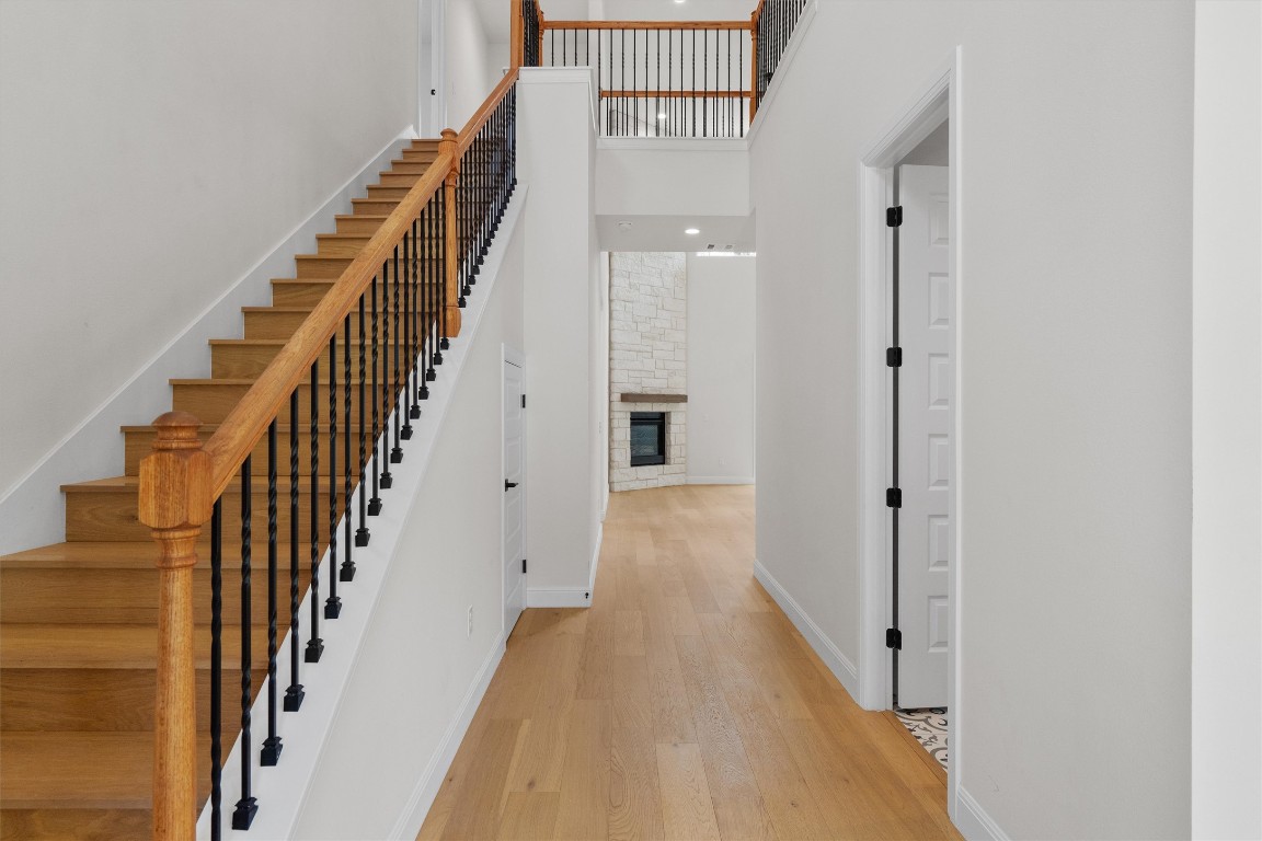 7705 Calcutta Run Drive Jonestown, TX 78645 - Photo 5 of 40 a view of a hallway with wooden floor and entryway