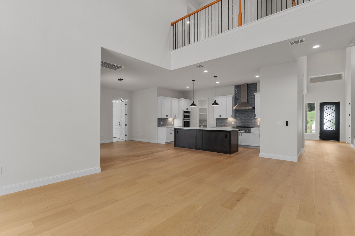 7705 Calcutta Run Drive Jonestown, TX 78645 - Photo 9 of 40 a view of a kitchen with a sink and cabinets