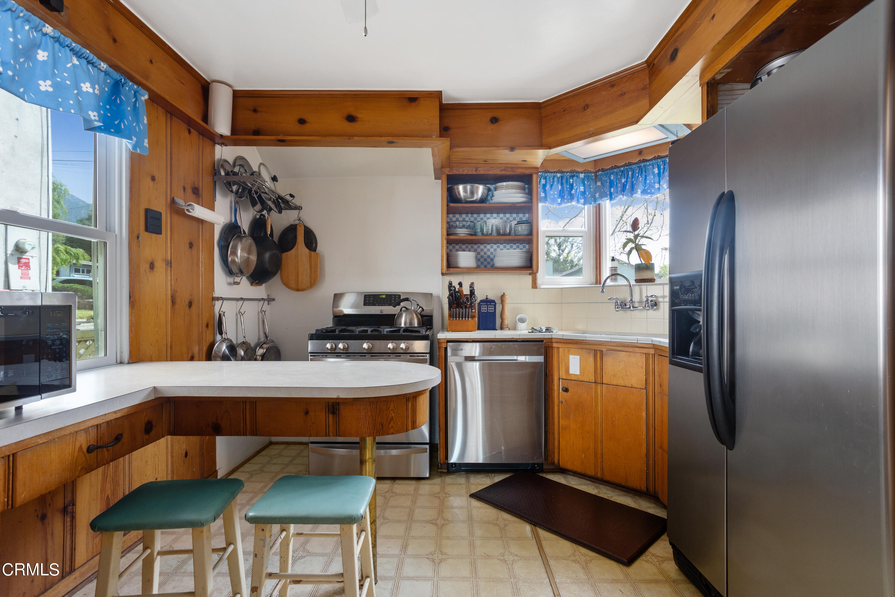 3067 Ewing Avenue Altadena, CA 91001 - Photo 12 of 37 a kitchen with stainless steel appliances granite countertop a refrigerator and a stove