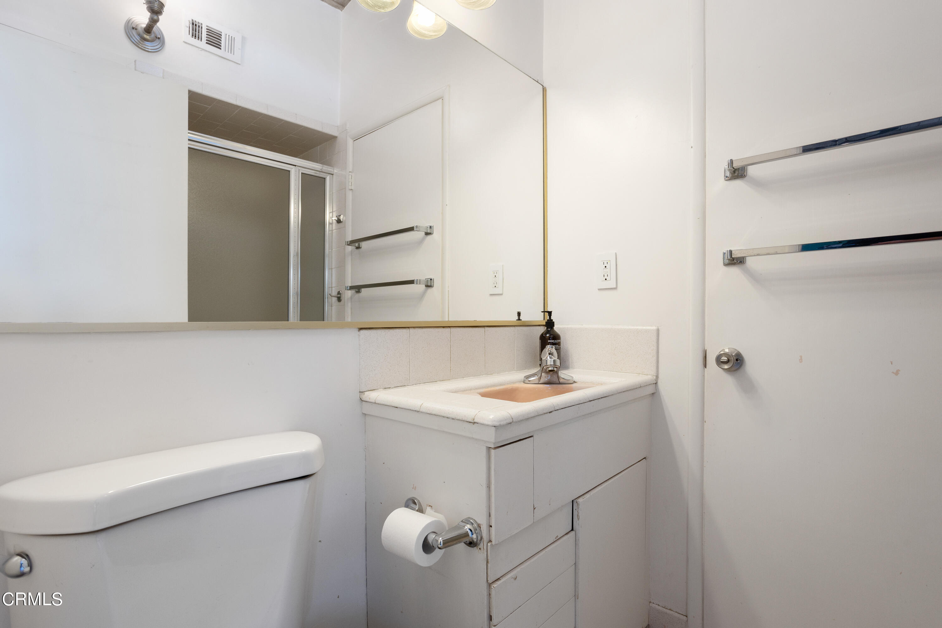 3067 Ewing Avenue Altadena, CA 91001 - Photo 24 of 37 a bathroom with a sink a toilet and mirror