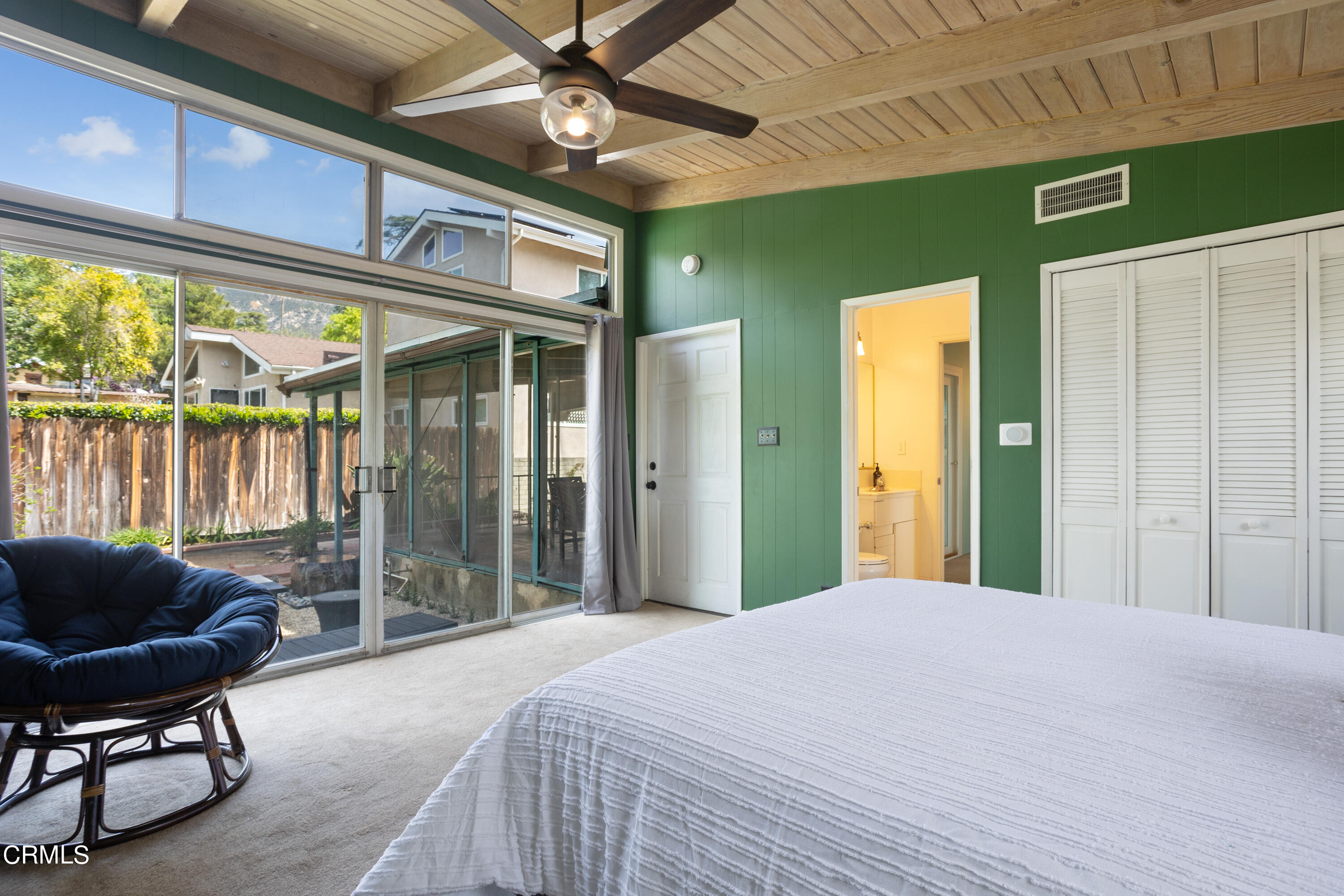 3067 Ewing Avenue Altadena, CA 91001 - Photo 27 of 37 a bedroom with a large bed and a large window