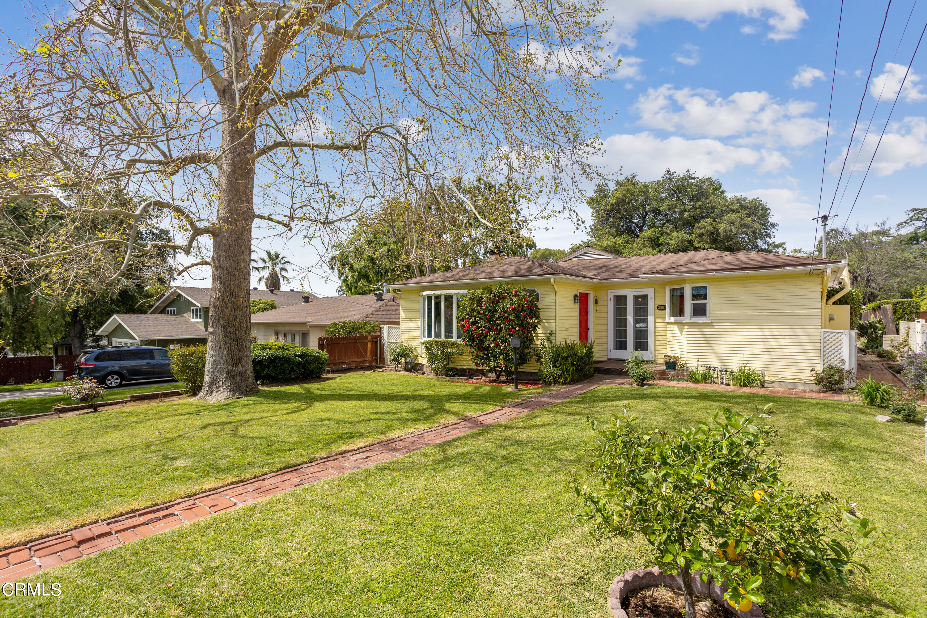 3067 Ewing Avenue Altadena, CA 91001 - Photo 3 of 37 a view of a house with a big yard and large trees