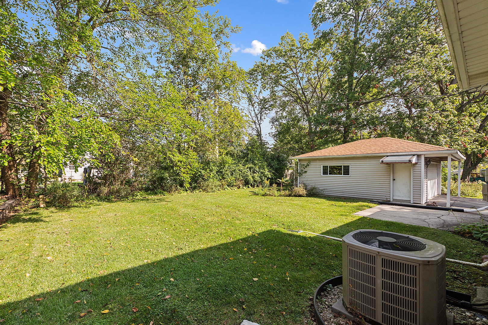 1352 Evergreen Road Homewood, IL 60430 - Photo 25 of 32 a backyard of a house with yard and outdoor seating