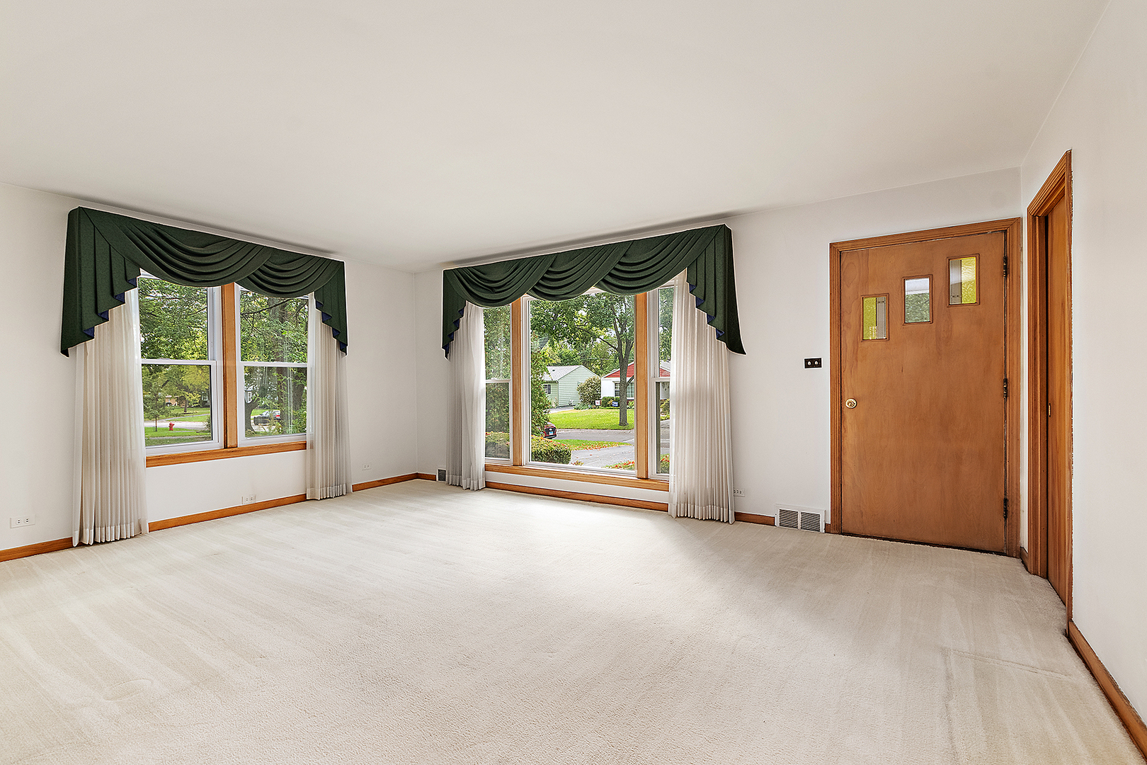 1352 Evergreen Road Homewood, IL 60430 - Photo 4 of 32 an empty room with windows view and front door