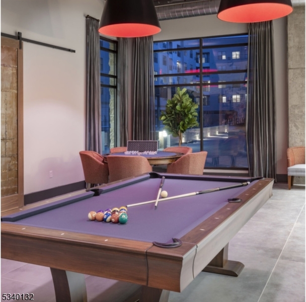 100 Union Street, Unit 429 Elizabeth, NJ 07202 - Photo 13 of 41 a room with furniture and table