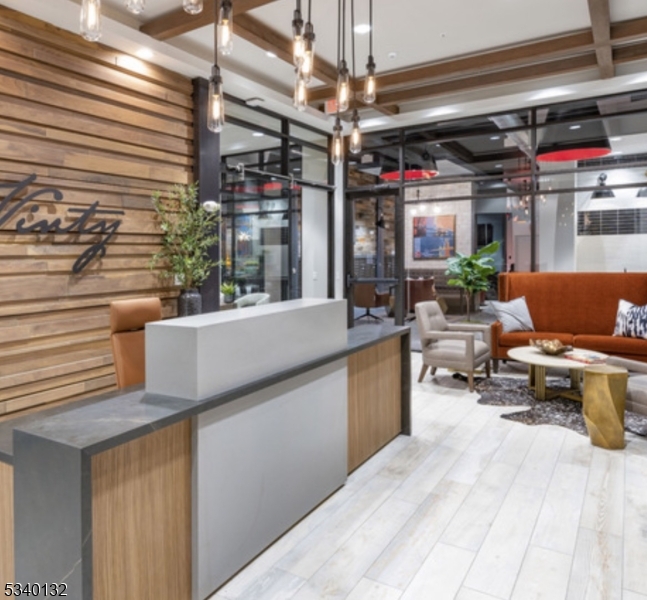 100 Union Street, Unit 429 Elizabeth, NJ 07202 - Photo 22 of 41 a living room with patio furniture and a chandelier
